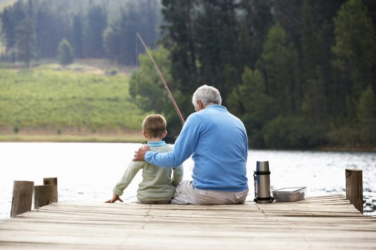 Person fishing at sunset, enjoying time outdoors